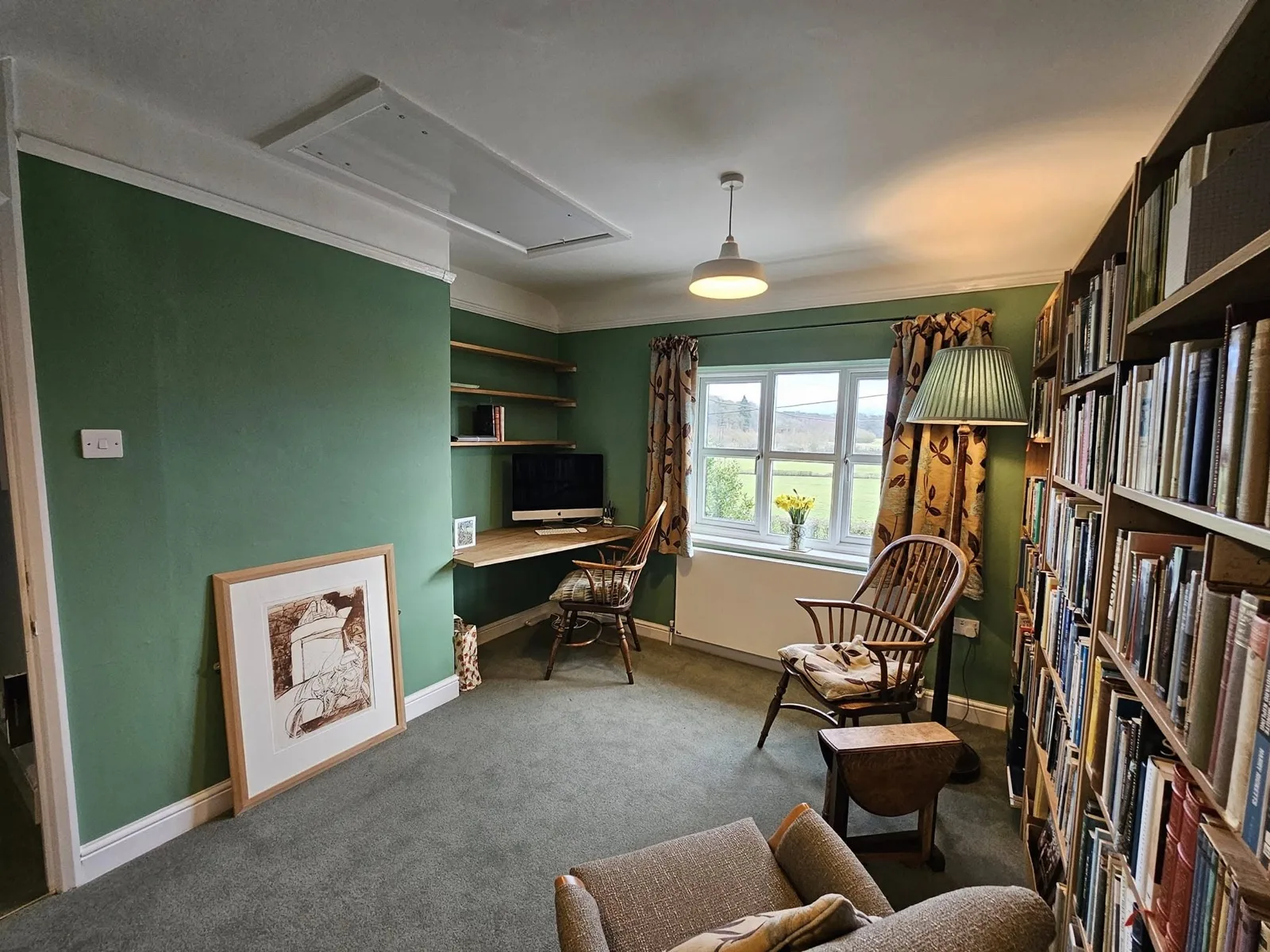 Home study after: repainted in heritage sage green with fitted shelving and desk