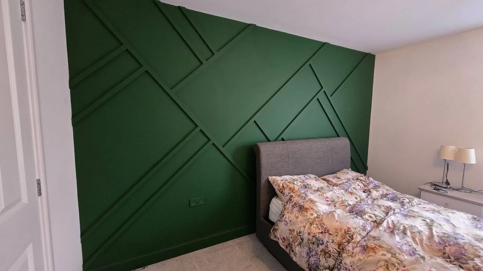 Feature wall after: battens finished in a deep forest green
